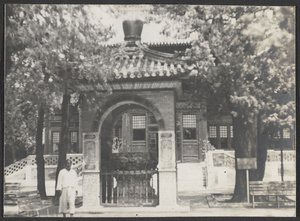 Man next to small pavilion