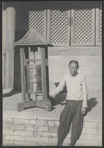 Man with prayer wheel