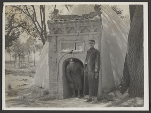 Hung Lo Fu, home of Ma Tsen-wu, & Pan Ch'iao, home of Ma Chin-hsi.  Unidentified person (left) coming out of a beehive kumpei and Rev. Claude L. Pickens, Jr. (right).