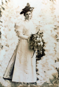 Ethel Mary Maitland (née Wilcockson) as a bridesmaid, with a bouquet of ferns and flowers, Shanghai