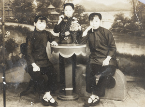 Studio portrait of three women with a telephone