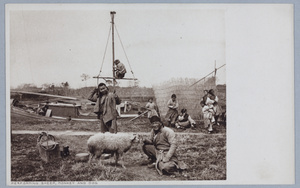 Men with performing sheep, monkey and dog