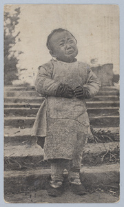 A child, seemingly about to burst into tears