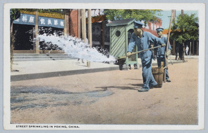 City workers watering a street (dust control), Beijing