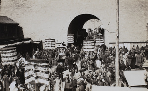 A funeral procession going through a city gate, Beijing 