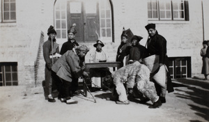 A tableau seemingly depicting a bear and its handler before a magistrate