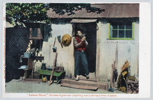 A man smoking a pipe by a doorway