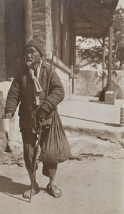 A blind man begging, Hong Kong