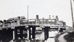 Stone bridge with gargoyle, over a sluice, Ningbo