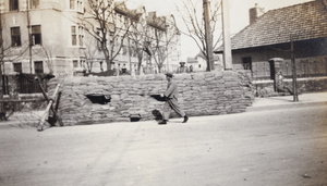 Soldiers on duty at a sandbagged guard post, Shanghai