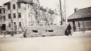 Soldiers on duty at a sandbagged guard post, Shanghai