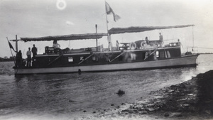 Crew and passengers aboard the houseboat 'Pursuit'