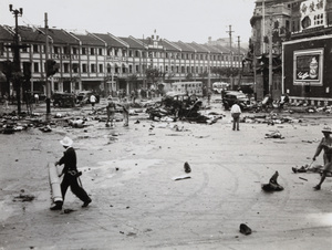 Emergency workers in the aftermath of bombing, 14 Avenue Edward VII and Yu Ya Ching Road, Shanghai, 14 August 1937