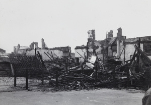 Bomb damaged buildings and barbed wire entanglements, Shanghai,1937