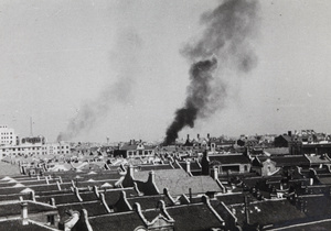 Smoke rising near Shanghai North Railway Administration Building, Zhabei, 1937