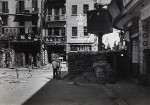 Sandbagged guard post near Pantheon Theatre, at the corner of Range Road and North Kiangse Road, Shanghai, 1937