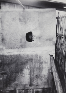 Damage beside a bamboo fence, Shanghai, 1937