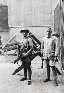 Nationalist soldiers between a gate and guard post, Shanghai, 1937