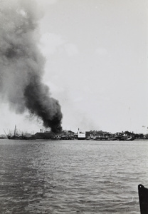 Smoke rising from Pudong docks, Shanghai, 1937