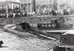 Torpedoed and partially sunk military launch, Shanghai Bund, 1937
