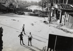 Three Chinese soldiers at the junction of North Honan Road and Boundary Road, Shanghai, 1937