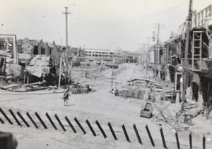 Chinese soldier crossing North Honan Road and Boundary Road, Shanghai, 1937