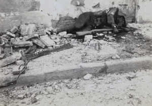 Corpse of Chinese soldier holding a rifle and hand grenade, Kungping Road, Shanghai, 1937