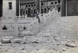 A boy scout photographing war damage at Greater Shanghai Municipality Civic Centre, Jiangwan, Shanghai