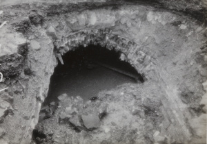Crater at Avenue Edward VII and Yu Ya Ching Road, Shanghai, caused by bomb dropped on 14 August 1937
