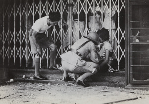 Injured women aided by Shanghai Volunteer Corps, 23 August 1937