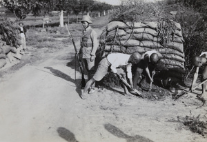 Nationalist soldiers (88th Division) and dugout near Hungjao, Shanghai, 1937