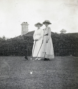 Women playing golf