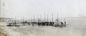 Racing sail boats on ice, at shoreline