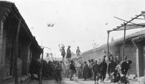 Three street performers on stilts