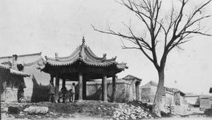 A small pavilion by a tree