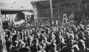 Crowd and butcher's stall