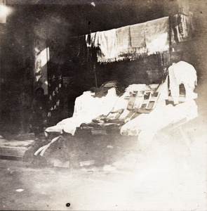 A street stall displaying haberdashery and rugs, Hong Kong