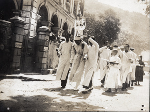 Mourners in a funeral procession, Hong Kong