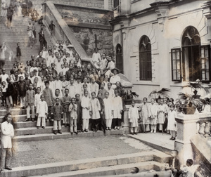 A group gathered outside the American Board Mission Building, Hong Kong