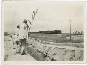 Eighth Route Army scouts watching a train -  perhaps reconnaissance prior to an attack, Central Hebei (冀中)