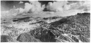 Dramatic aerial view of mountains and clouds