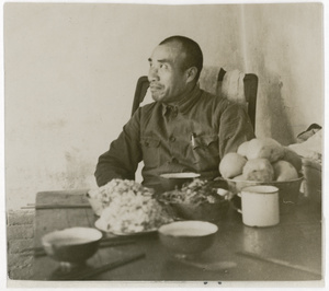 General Zhu De (Chu Teh 朱德) sitting by a table, with food