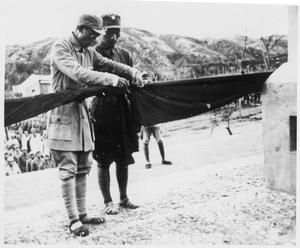 Two military men with a banner, by the Jinchaji Border Region War Resistance Martyrs' Memorial (晋察冀边区抗战烈士纪念塔), Tang County (唐县), Hebei Province