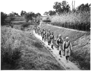 Michael Lindsay (林迈可)'s escort on a path through fields of crops