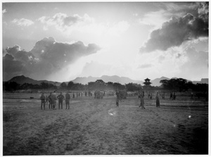 Soldiers on parade and spectators, with a pagoda in the background, Wanxian Zhan, Hebei, 1938