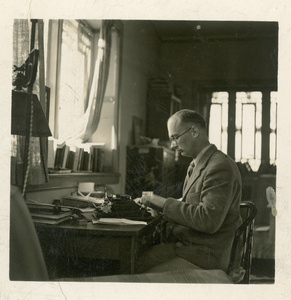 Michael Lindsay (林迈可) typing in an office, Yenching University (燕京大學), Beijing (北京)