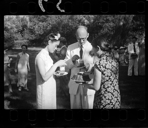 Hsiao Li Lindsay (李效黎) with Michael Lindsay (林迈可) and cake server, at their wedding party at Yenching University (燕京大學), Beijing (北京)