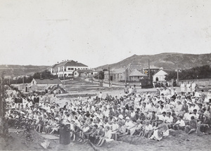 Children sitting on sand 'benches', CSSM, Yantai