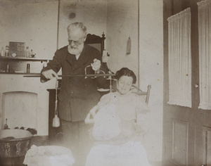 George Nicoll, with his wife Rachel Carlyle Nicoll, weighing one of their baby daughters