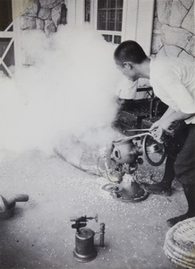 Making popcorn on the verandah of a holiday bungalow, Beidaihe